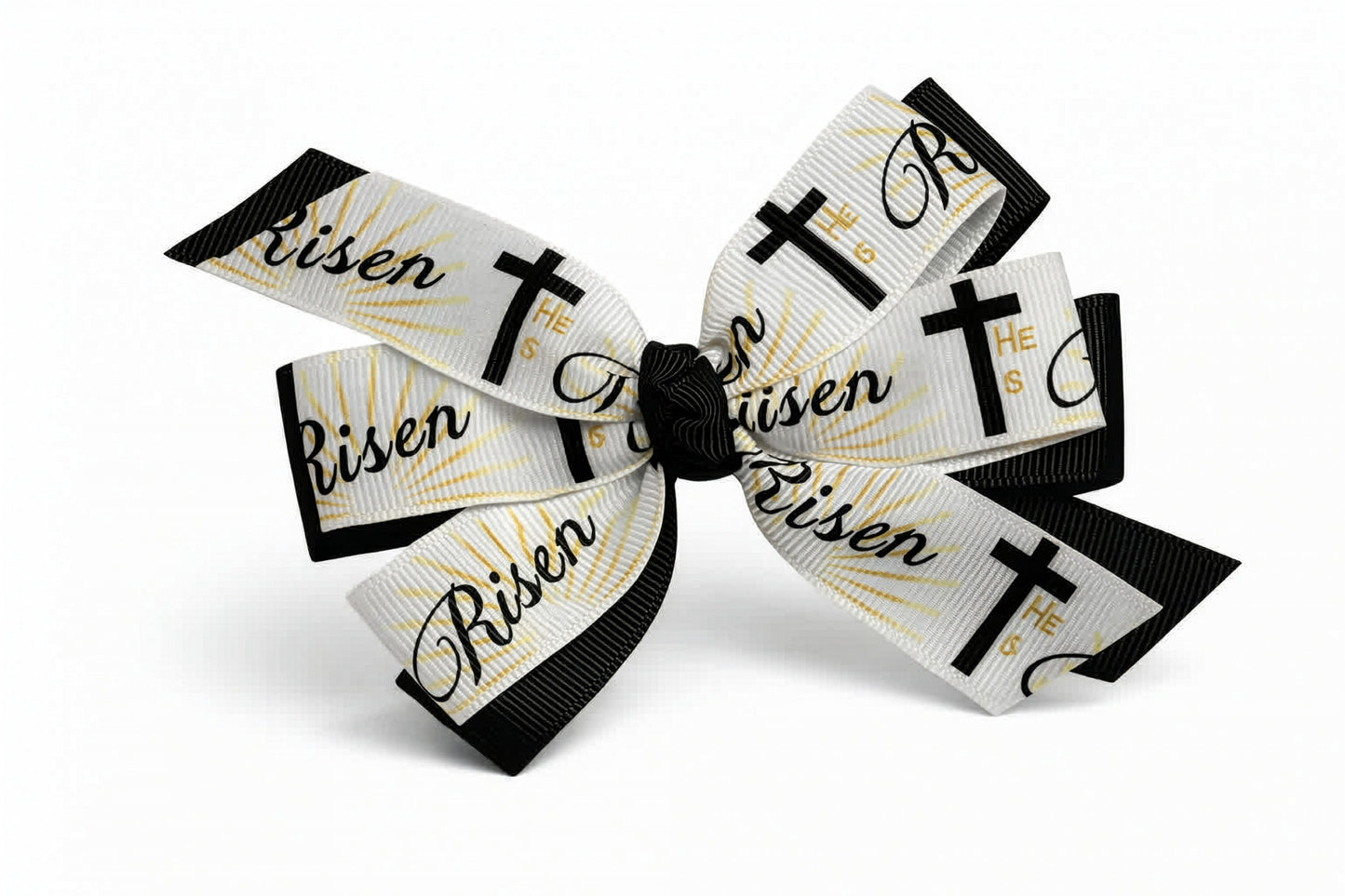 Bow with 'Risen' and cross designs on a white background