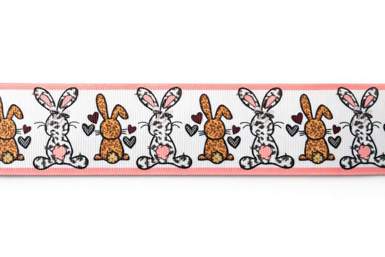 Decorative ribbon with cartoon bunnies and hearts on a white background
